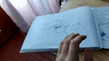a book is open to a page that has the word tiktok written in black marker
