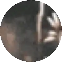 a blurred image of a person 's face in a dark room