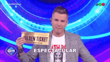 a man in a suit holding a golden ticket