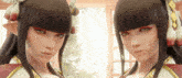 two anime girls are standing next to each other in front of a window
