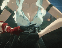 a close up of a woman 's torso with a white shirt and red gloves
