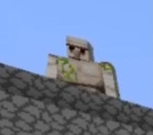 a statue of a man standing on top of a stone wall in a video game .