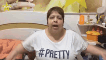 a woman wearing a white shirt that says pretty on it