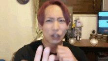 a man with red hair making a funny face