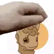 a hand is holding a sheep 's head in front of a circle .