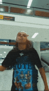 a person wearing a black t-shirt that says ' youth ruth ' on it