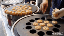 a person is cutting a cookie with a knife and the words made in animotica are on the bottom of the image