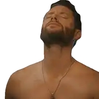 a shirtless man with his eyes closed and a beard