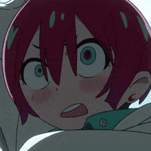 a close up of a girl with red hair making a funny face