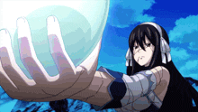 a woman with long black hair is holding a sphere in her hands