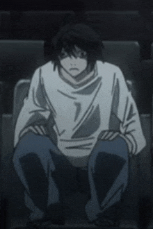 a person is sitting in a chair with their legs crossed