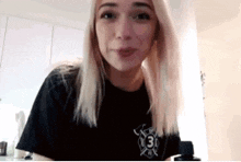 a woman wearing a black shirt with the number 31 on it