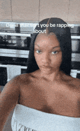a woman taking a selfie with a caption that says do all that s n't you be rapping about