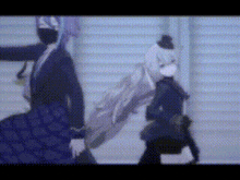 a couple of anime characters standing next to each other . one of the characters is wearing a mask .