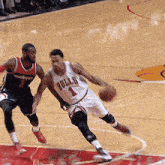 a basketball player for the bulls is dribbling the ball