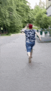 a blurry image of a person running down a street