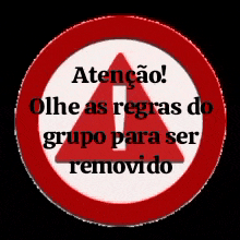 a red and white sign that says " atencion " on it