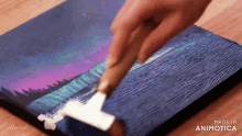 a person is painting a picture with a brush and the words made in animatica on the bottom