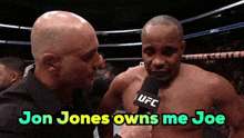 jon jones owns me joe is being interviewed by a man with a microphone