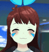 a close up of a girl 's face with blue tears on her eyes
