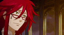 a close up of a person with red hair and glasses