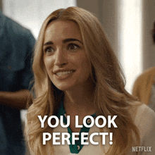 a blonde woman is smiling and says you look perfect