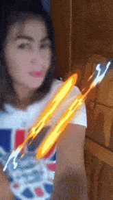 a woman in a white shirt with a british flag on it takes a selfie