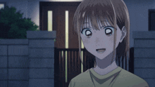 a girl in a yellow shirt has her eyes closed
