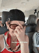 a woman wearing sunglasses and a hat with the words me pag wala si bebe written below her