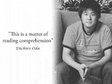 a man is sitting on a couch next to a quote .