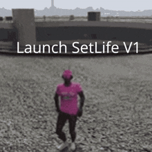 a man in a pink shirt stands in front of a launch setlife v1 sign