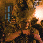 a woman in a wig with a butterfly on her head has josephquinngifs written on the bottom of the image