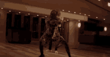 a man and woman are dancing together in a dark room .