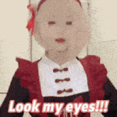 a woman in a maid costume says " look my eyes "