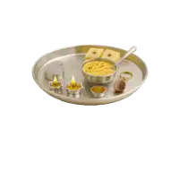 a silver tray with a bowl of food and two candles on it