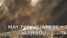 may the fourth be with you is written on a blurred background