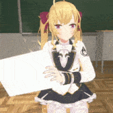 a girl in a school uniform holds up a piece of paper