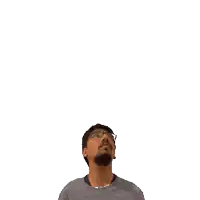 a man with a beard and glasses looks up at the number 21