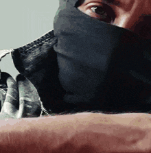 a close up of a man wearing a mask on his face