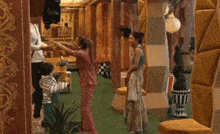a man and a woman are dancing in a hallway .