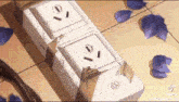 a close up of a broken electrical outlet on a table with petals .