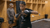 a woman wearing a shirt that says " ufc " on it