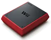 a red and black nintendo wii is sitting on a white surface