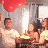 a group of people are celebrating a birthday with a zoomcharts.com logo