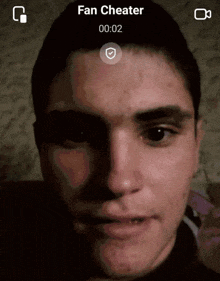 a close up of a man 's face with the words fan cheater on the top