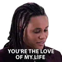 a woman with dreadlocks and a necklace says you 're the love of my life