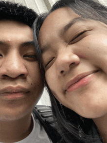 a man and a woman are making funny faces