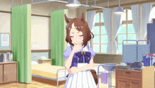 a girl with a horse 's head is standing in a hospital room with green curtains