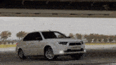 a white car with the license plate 99 pk 108