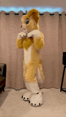 a furry dog mascot is standing in a living room
